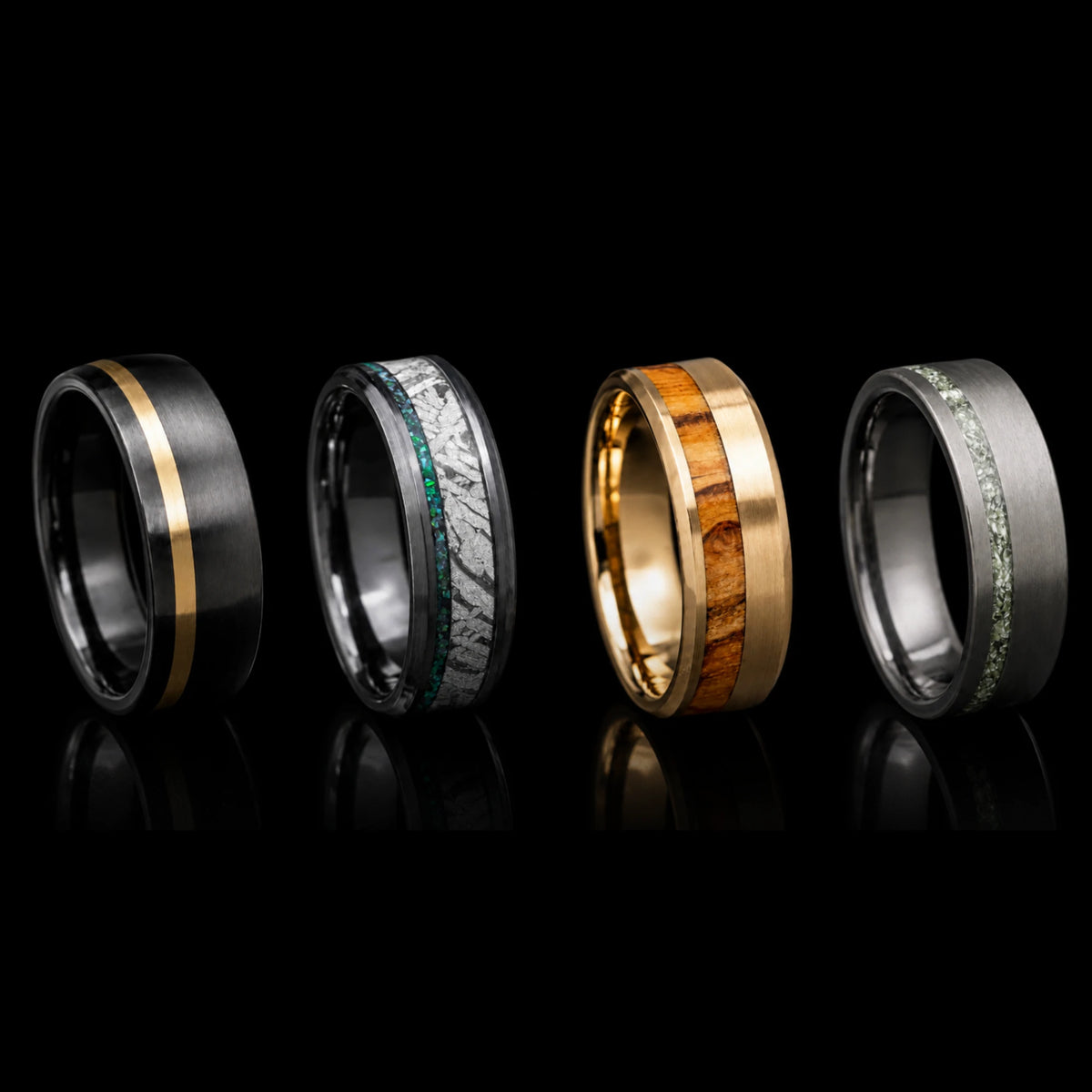 Four Sesto Synergy wedding bands with inlays on a black background