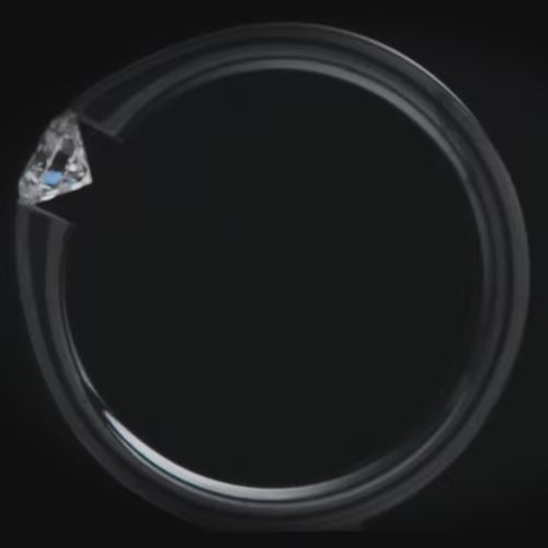 Black titanium wedding band with tension set diamond, free engraving, 7mm mens wedding ring, brushed flat profile.