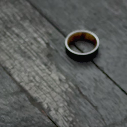 Black Titanium Wedding Band with Silver Spalted Birch Inner Sleeve, 7mm Men's Wedding Ring, Unique Design, Free Engraving, showcased with black gloves.