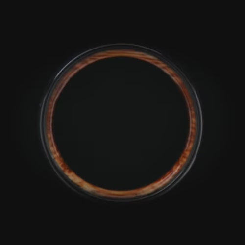 Black titanium ring with lapis lazuli inlay and whiskey barrel oak sleeve, 7mm mens wedding band, unique design, free engraving available.