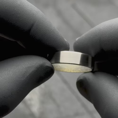 14KW mens wedding band with moonstone inner sleeve, featuring a brushed flat profile and 6mm width, showcased in a video with black gloves; includes free engraving and custom options.