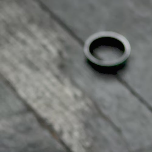 Zirconium wedding band with malachite inlay, 7mm men's ring, brushed flat profile, unique design, free engraving, showcased with black gloves.