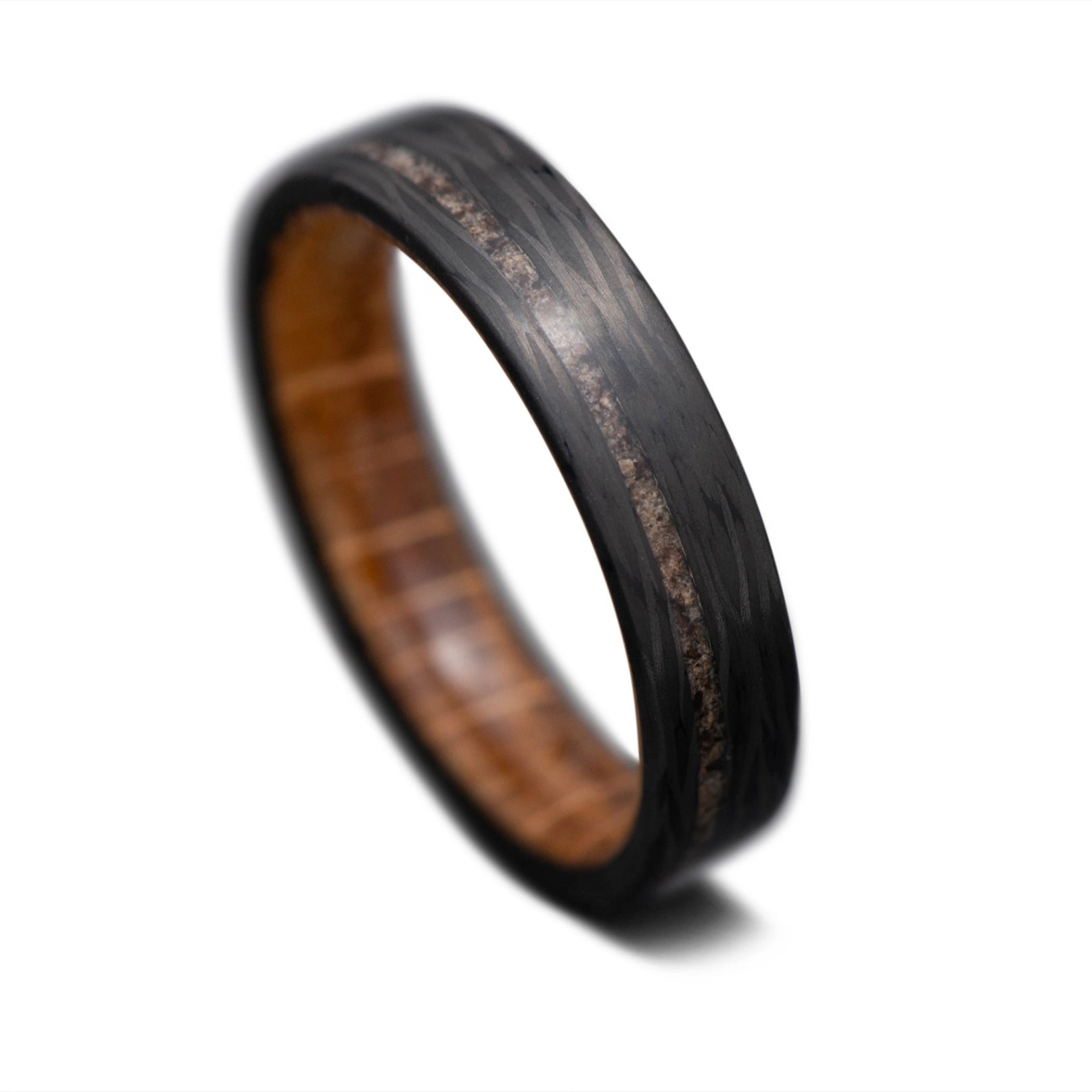 Carbon Fiber Wave ring with TRex Inlay and Whiskey Barrel Wood Sleeve